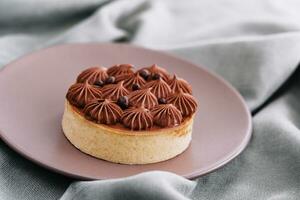 Chocolate cake on a ceramic plate photo