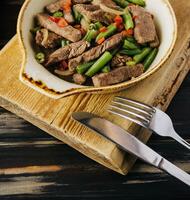 Veal with green beans and chilli pepper photo
