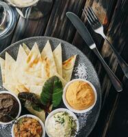 Assorted of oriental food, mezze top view photo