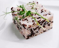 boiled mixed rice on white plate photo