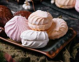 marshmallow cakes in chocolate glaze and christmas decor photo