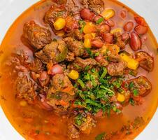 Mexican dish chili con carne in plate photo