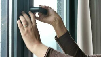 hand open gray plastic pvc window at home at early morning video