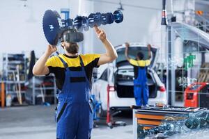 Technician in car service using holographic augmented reality device to repair broken motor. Specialist in garage fixing client automobile with AR technology, ensuring optimal automotive performance photo