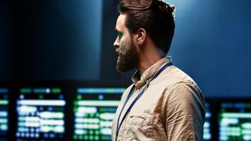Close up of computer scientist monitoring server hub, optimizing it for data processing requirements of AI workloads. Supervisor overseeing neural network high tech facility used for machine learning photo