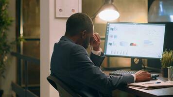 Pissed off computer operator fed up with loud colleague listening to music and pretending to beat drums at work. Businessman annoyed by bothersome coworker perturbing him in office photo