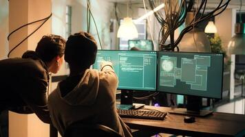 Male hacker using knowledge of computer science to access important data illegally, breaking into network system or server. Thief doing cryptojacking and espionage with virus. photo