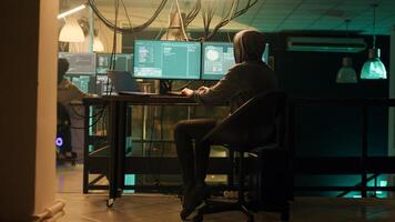 Male spy creating breach of security after gaining access to network system, hacking computer to steal government information. Man doing hacktivism work, ransomware and identity theft. photo