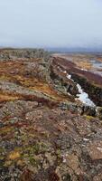 Rocky cliffs icelandic wilderness in national park, majestic natural scenery with massive rock formations inside hiking valley. Spectacular nordic landscape with stone mountain wall hills. photo