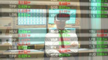 Businessman analyzes financial data on a display screen using virtual reality headset, tracking stock market and currency exchange. Investor comparing bonds prices, learning pricing trends photo