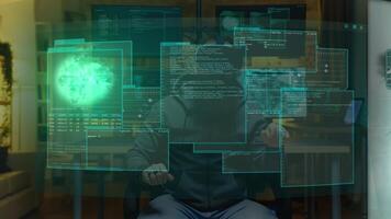 Hacker at home using augmented reality holographic visualization to write malicious code to be used as virus, planning to infect businesses internal servers, steal valuable data and demand ransom photo