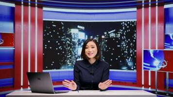 Media broadcaster hosting talk show late at night, discussing about important global events on live television program. Asian woman working as journalist with entertainment tv segment. photo