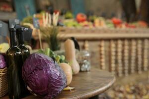 Local bio products on display at farmers market with fresh organic agricultural produce. Various colorful eco seasonal fruits and vegetables on table at fair or harvest festival. Close up. photo