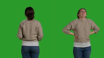 Close up of negative adult expressing disagreement in studio, acting furious and being in conflict on camera. Young woman disapproving with something, being mad and angry over greenscreen. photo