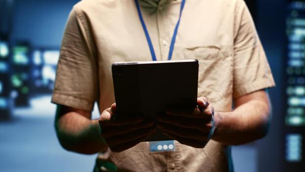 Programmer doing annual auditing, extending high tech facility hardware life span and avoiding downtime. Developer checking supercomputer infrastructure for power fluctuations, close up photo