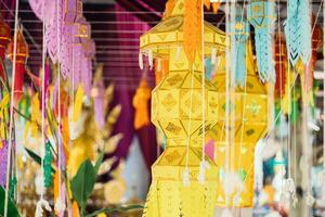 Yipeng Northern Thai culture hanging lantern paper lamp beautiful colorful Lanna traditional festival in temple. photo