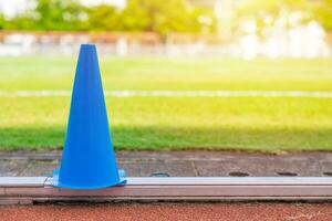 football grass field running track and training cone for sport exercise outdoors activity background photo