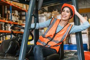 happy young teen warehouse staff worker enjoy smiling at forklift driver for control loading factory inventory shipping products photo