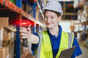 portrait happy young women warehouse worker working in products shipping storage cargo store photo