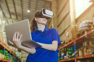 smart worker using modern advance technology digital VR device to control operate manage industry products stock warehouse photo