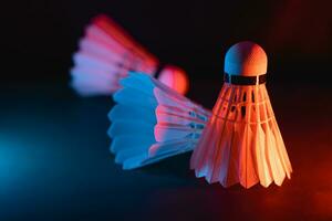 badminton shuttlecock on court in vibrant lighting decoration for competitive high performance indoors rackets sports game tournament match equipments for advertising graphics image photo