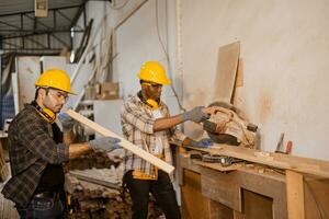 carpenter joiner worker men work in furniture factory, professional wood worker staff employee handcraft in wood workshop. photo