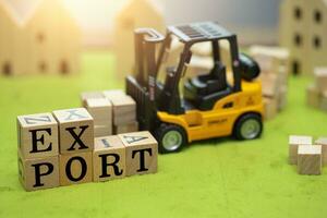 forklift truck with wood block with word EXPORT toy decoration for export shipping cargo concept photo