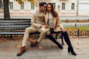 Stylish couple in love posing outdoor. Autumn fashion trends. photo