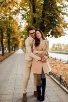Romantic moments. Happy beautiful couple in love  walking  in autumn park. photo