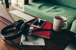 Handsome hipster man with beard using lap top at home photo