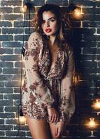 Brunette attractive  lady enjoying  new year or  masquerade  party. photo