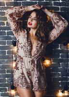 Brunette attractive  lady enjoying  new year or  masquerade  party. photo