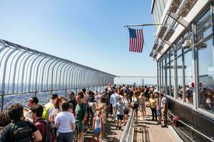 New York City, USA - August 9, 2019-people on the famous observation deck of the Empire State Building on a sunny day photo