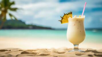 Summer drink with blur beach on background. Pina colada on the beach photo