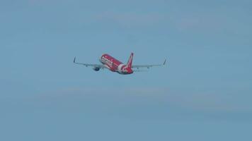 PHUKET, THAILAND DECEMBER 3, 2018 - Airbus A320, HSBBI of AirAsia taking off at Phuket airport, side view. Airplane departing. Passenger flight leaving video