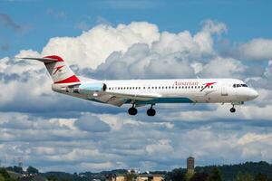 Austrian Airlines passenger plane at airport. Schedule flight travel. Aviation and aircraft. Air transport. Global international transportation. Fly and flying. photo