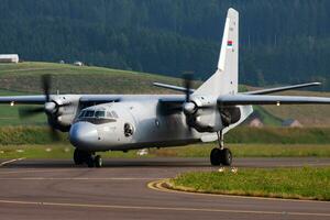 Military transport plane at air base. Air force flight operation. Aviation and aircraft. Air defense. Military industry. Fly and flying. photo