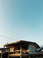 photovoltaics on the roof of a house and a beautiful sky with the setting sun. Concept of sustainable resources photo