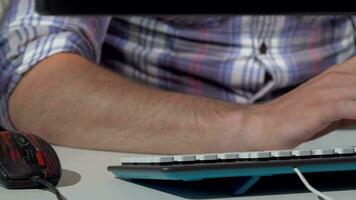 Cropped shot of a man working on computer typing on the keyboard video