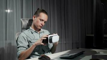 Young man using virtual reality 3D glasses late at night video