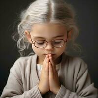 Praying girl dark background - AI generated photo