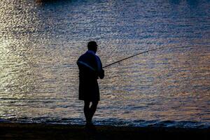 A man fishing photo