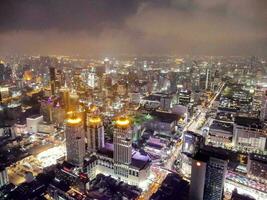 an aerial view of a city at night photo