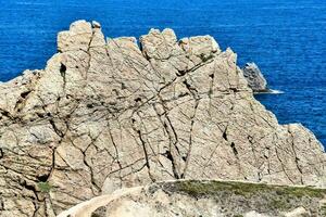 A rock by the sea photo