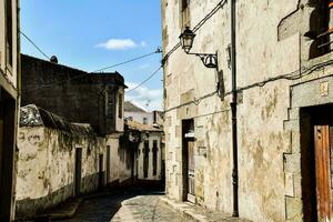 a narrow street with old buildings photo