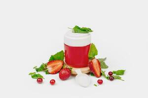 Fruit jelly in a jar with fresh strawberry and mint. Mockup dessert. Healthy food. Close-up Strawberry jelly on white background. Free space for text photo