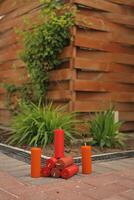 Set of colorful decorative natural beeswax candles with a honey aroma for interior in the backyard photo