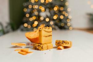 Christmas mockup concept pumpkin snacks on a white background. Pumpkin figuratively in a tray and new year decor photo