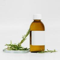 Cosmetic brown glass bottle and rosemary branches on white background. Background for cosmetic product branding, corporate identity and packaging inspiration. Mockup photo