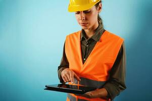 Woman with helmet who work in a warehouse photo